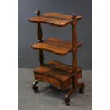 Victorian Rosewood Watnot, the Three Shaped Shelves above a Single Drawer raised on Scroll Legs