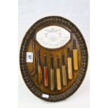 Wood effect oval Plaque depicting "The Development of the Cricket Bat"