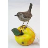 Mike Wood hand painted Wooden model of a Wren on an Apple and dated 2005, stands approx 14cm tall