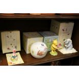 Four boxed Winnie the Pooh related ceramics by Royal Doulton to include Figurines and a Money box