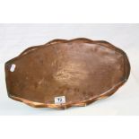 Arts & Crafts style oval Copper tray with wavy edge and Fish design, marked to face side A C Snow,