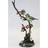 Mike Wood hand painted Wooden model of a pair of Blue Tit's, dated 2004 and standing approx 38cm