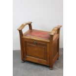 Early 20th century Mahogany Piano Stool with Brass Studded Leather Seat above a hinged drop door