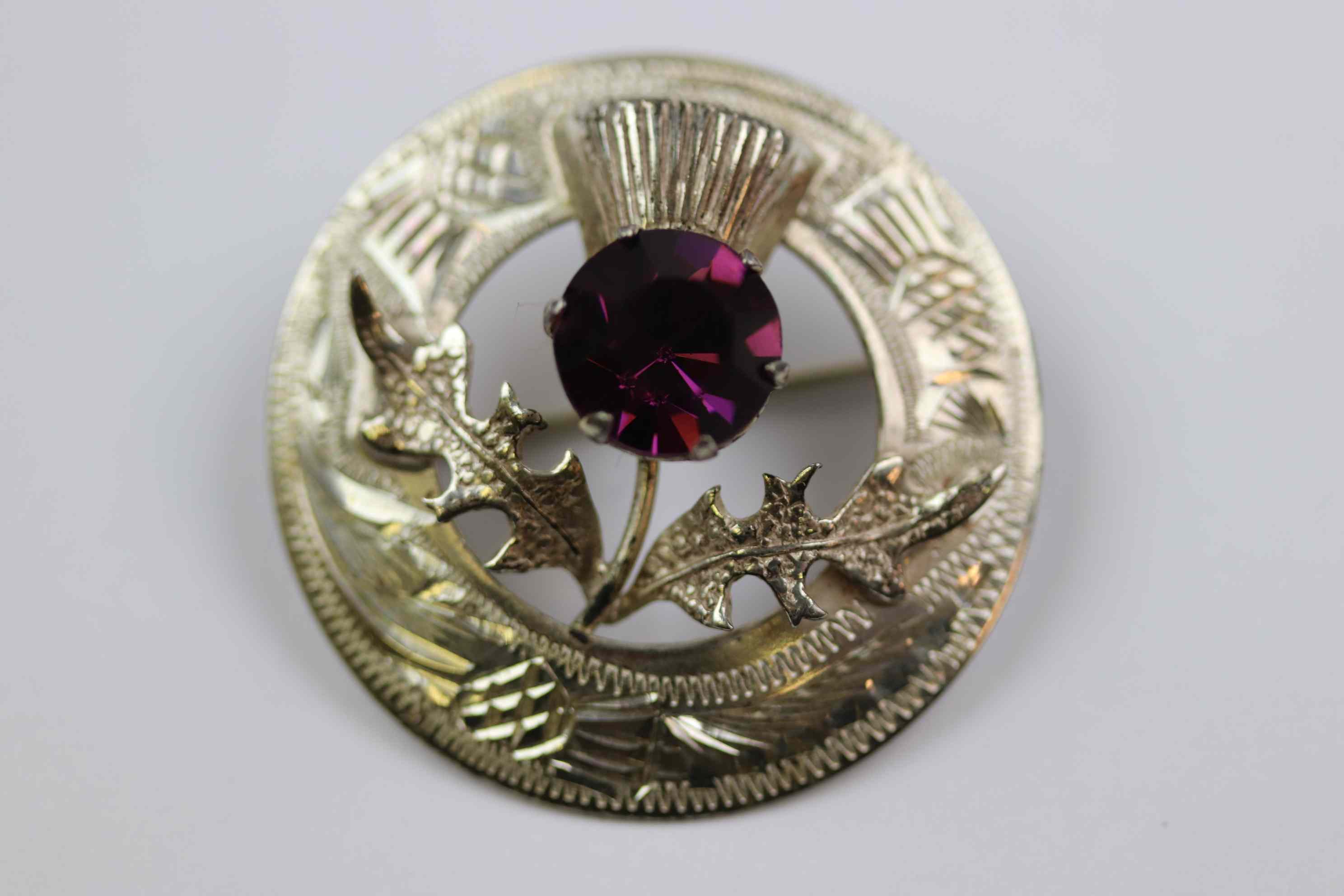 Mid twentieth century Scottish silver paste set thistle brooch, purple paste stone forming the - Image 2 of 7