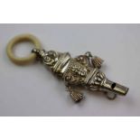 Late Victorian ivory and silver babies rattle and whistle, the silver whistle with cast cherub and