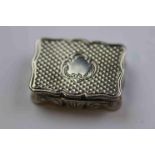 Mid Victorian miniature silver vinaigrette, of rectangular form with pie crust border, engine turned