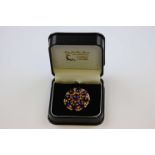 Amethyst 9ct yellow gold target brooch, the central circular cabochon cut amethyst diameter