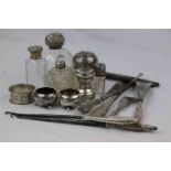 Collection of silver items to include a pair of silver open salt cellars raised on three ball