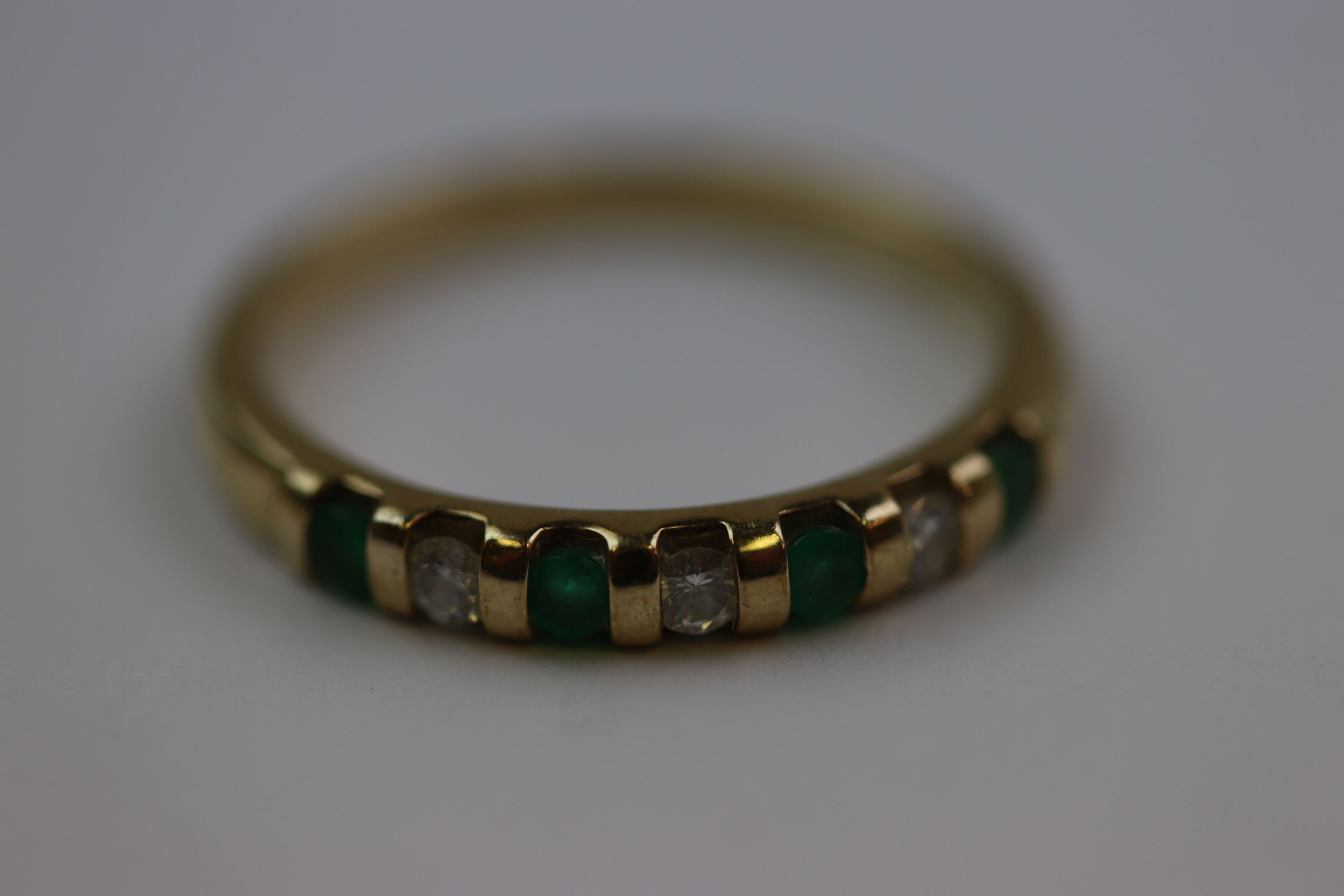 Emerald and diamond seven stone 9ct yellow gold dress ring, four small round mixed cut emerald and - Image 4 of 10