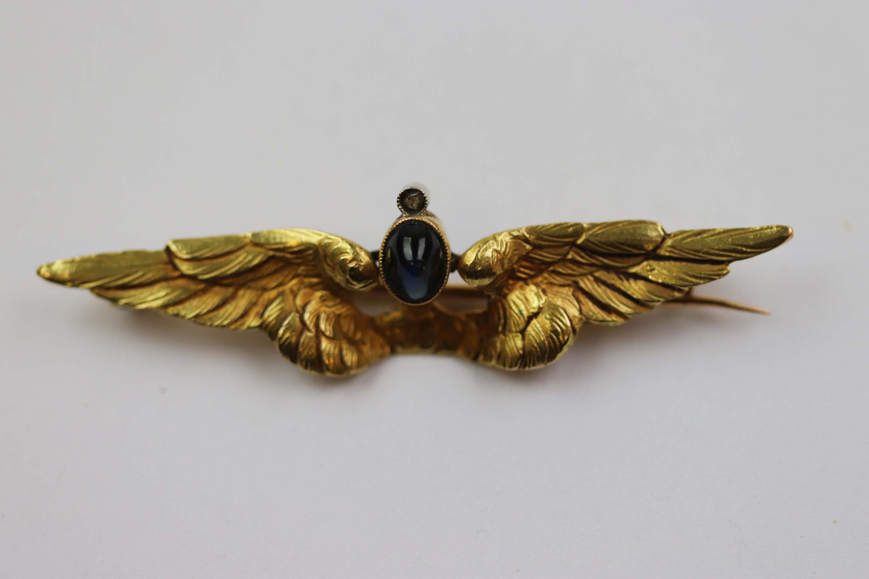 French 19th century sapphire and diamond 18ct yellow gold wings brooch, the textured feathered wings