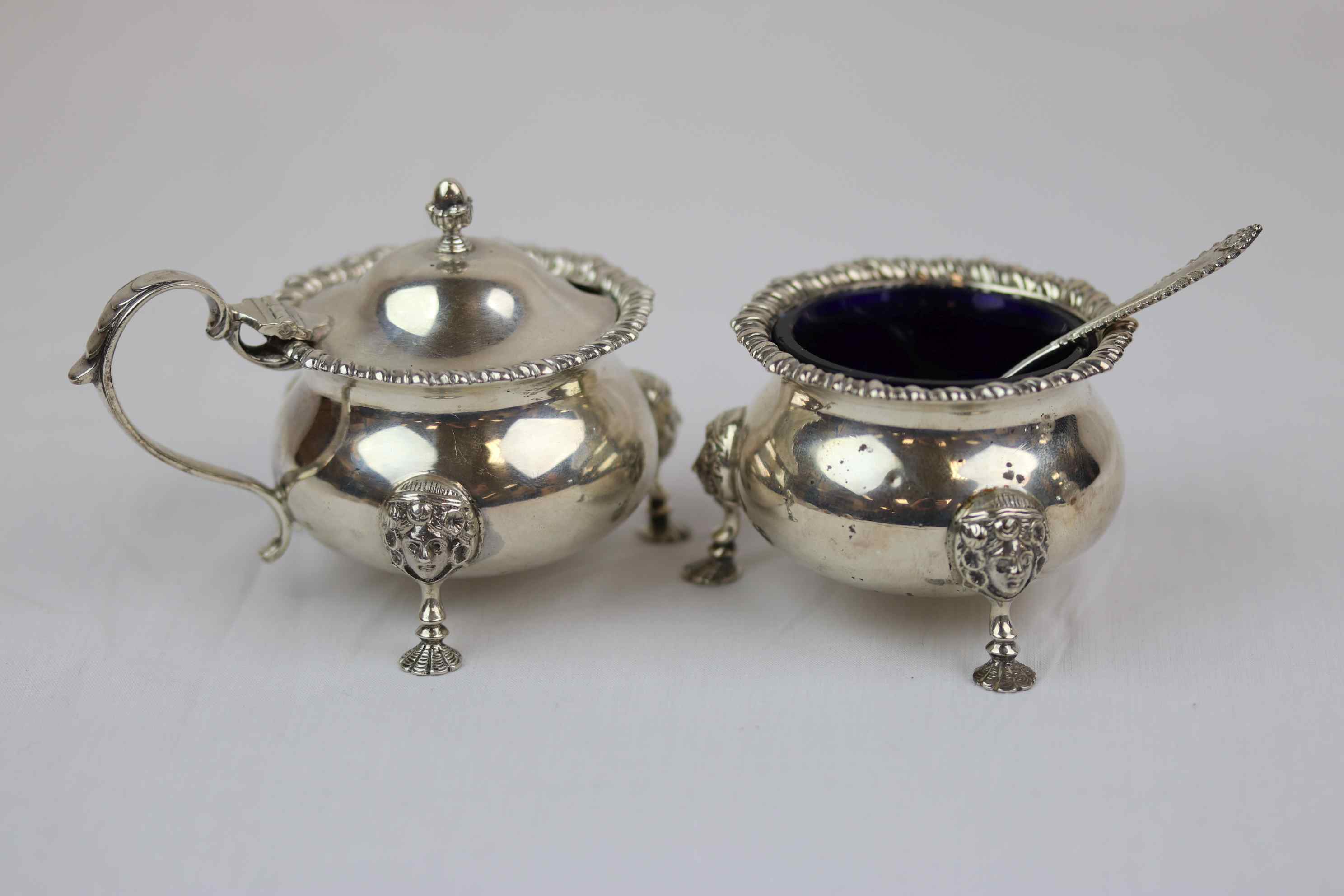 Mappin & Webb Georgian style silver salt cellar and mustard pot of cauldron form raised on three