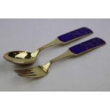 Anton Michelsen; Danish enamelled silver gilt Christmas spoon and fork pair, blue enamelled