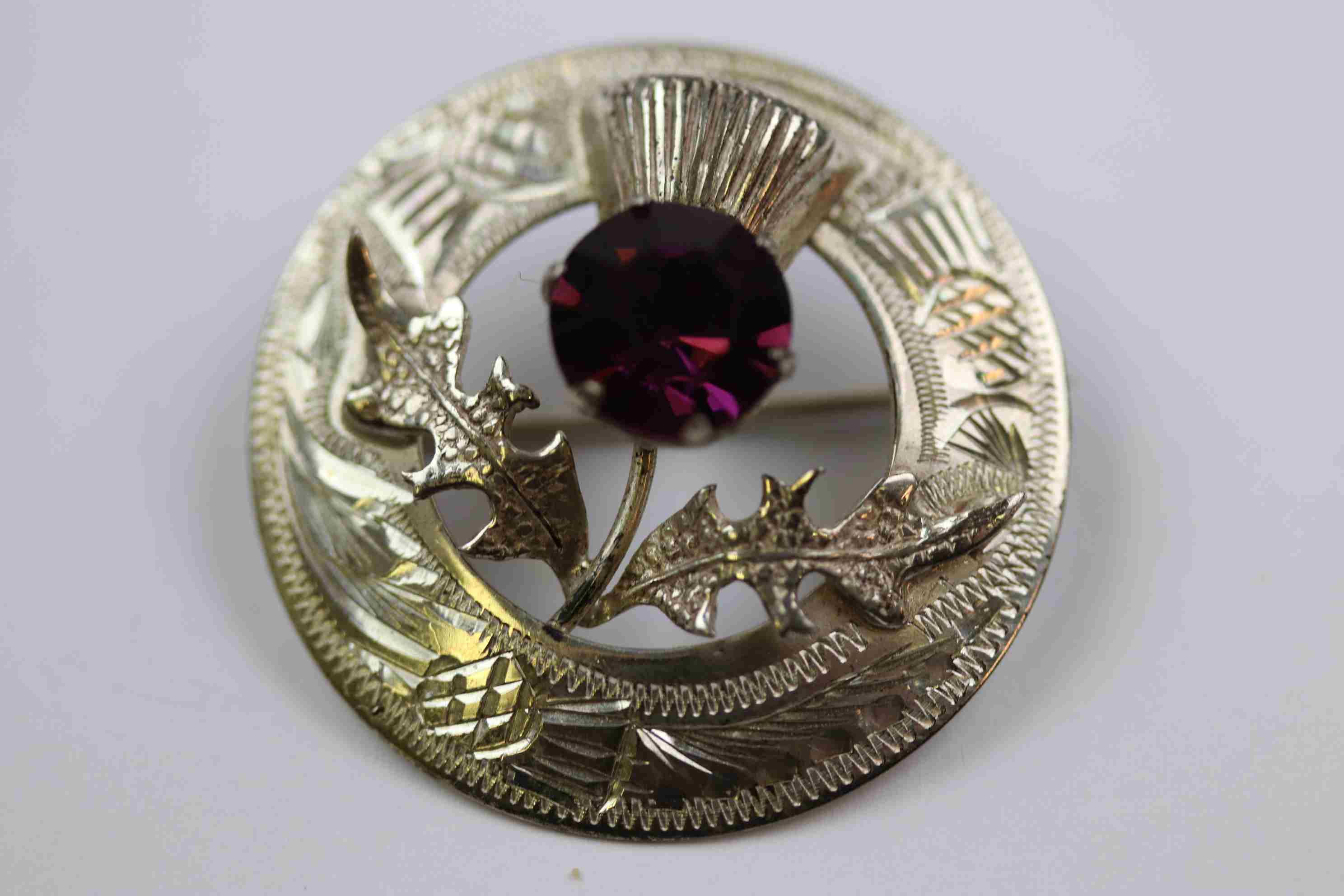 Mid twentieth century Scottish silver paste set thistle brooch, purple paste stone forming the - Image 7 of 7