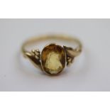 Citrine 9ct yellow gold dress ring, the oval mixed cut citrine measuring approximately 9mm x 6.