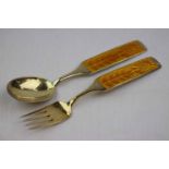 Anton Michelsen; Danish enamelled silver gilt Christmas spoon and fork pair, yellow basse-taille