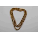 Yellow metal rope twist necklace, assessed as gold with 9ct rose gold hoop, length approximately