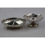 Early George V silver oval bon bon dish raised on four bun feet, pierced repeating oval design,