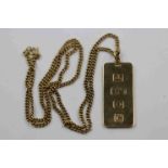 9ct yellow gold ingot pendant, length approximately 3.5cm on 9ct yellow gold curb link chain