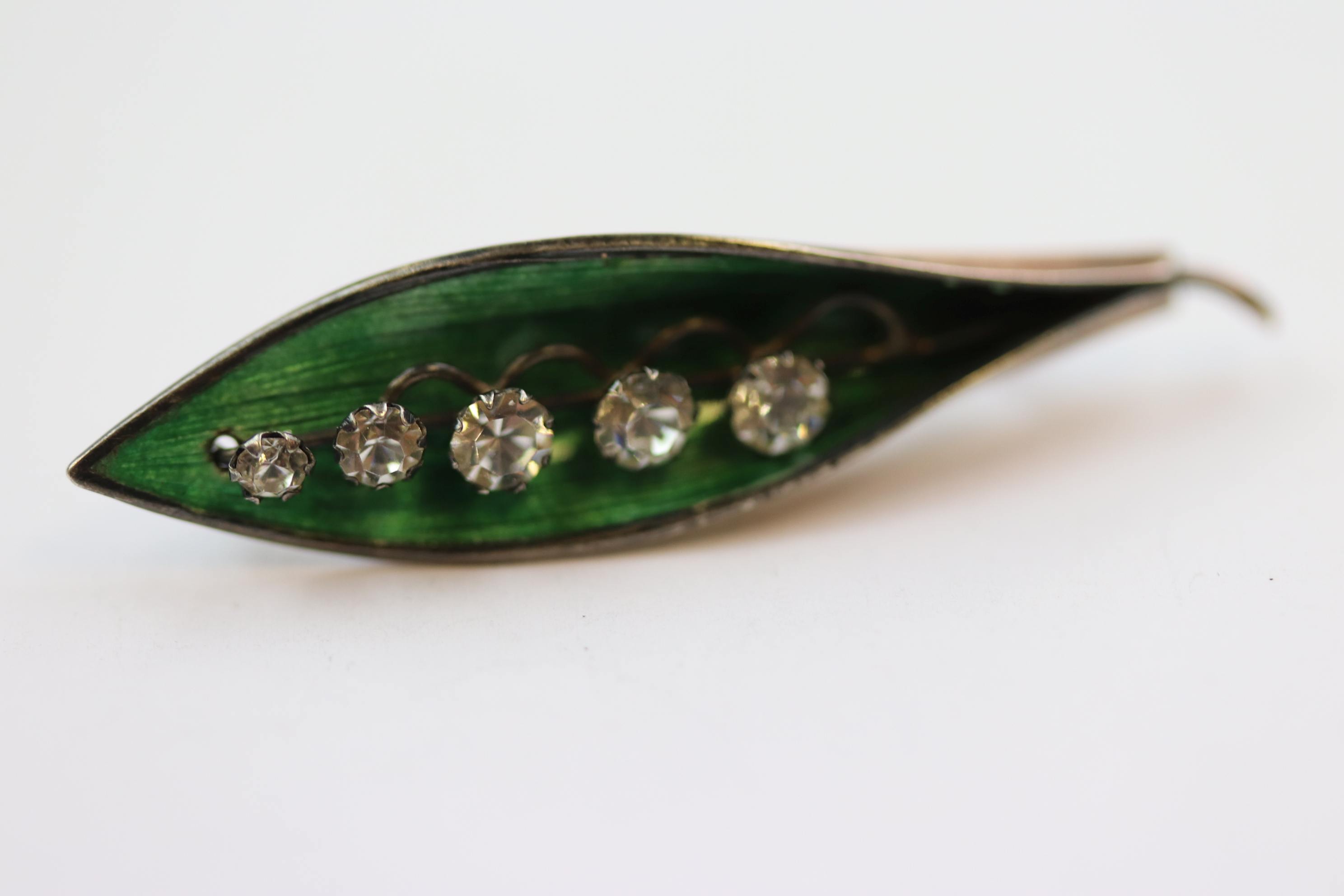 Enamelled gold plated brooch modelled as lily-of-the-valley, five graduated paste stones set to - Image 2 of 5