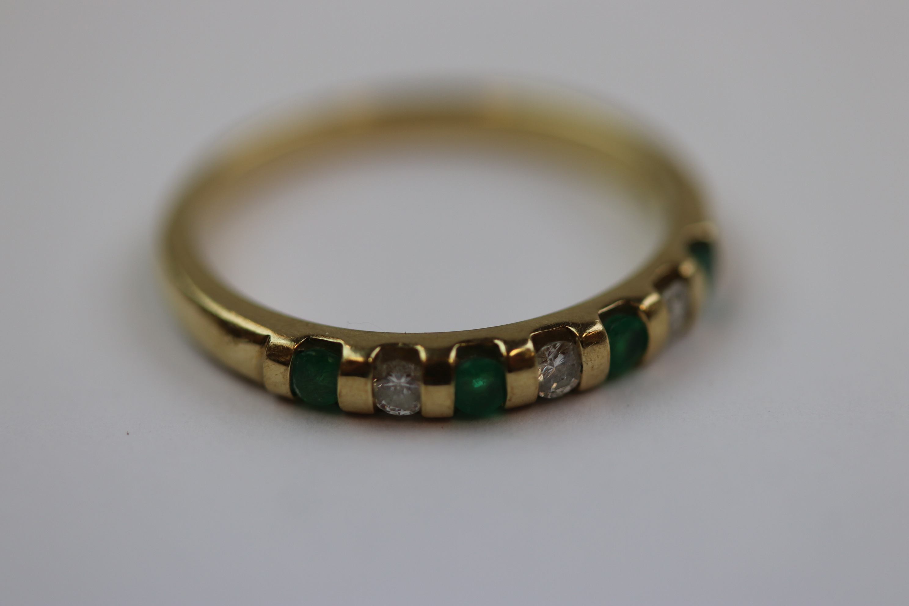 Emerald and diamond seven stone 9ct yellow gold dress ring, four small round mixed cut emerald and - Image 8 of 10