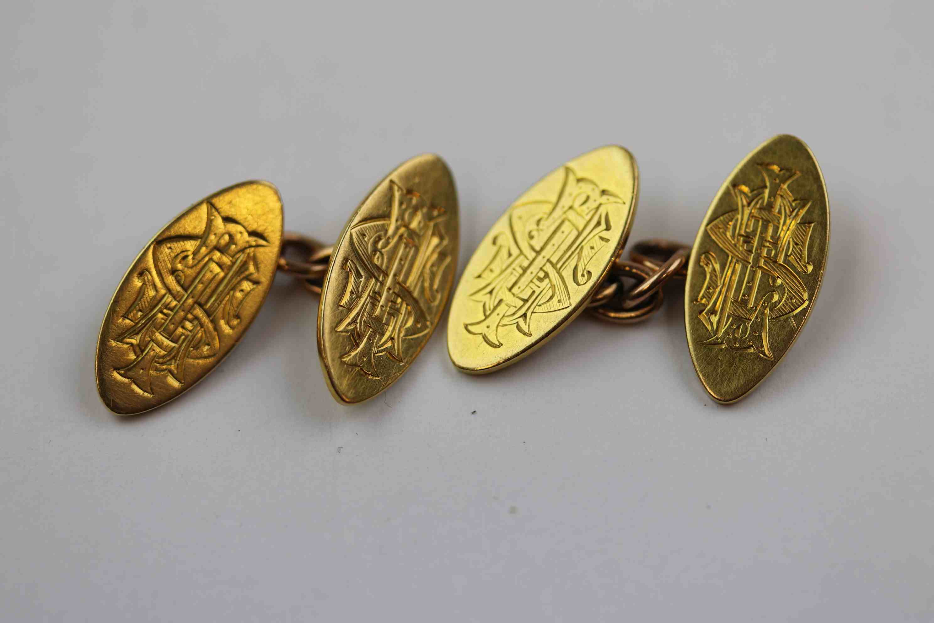 Pair of 18ct yellow gold chain link cufflinks, each navette shaped panel with engraved initials