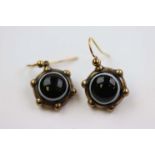 Pair of Victorian bulls eye agate yellow metal drop earrings, the circular cabochon cut bulls eye