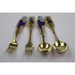 Anton Michelsen; two pairs of Danish enamelled silver gilt Christmas spoons and forks, each pair