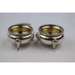 Pair of mid Victorian silver open salt cellars, cauldron form raised on three feet, bead