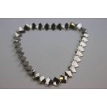 Mid twentieth century Scandinavian style necklace formed of interlocking square panels, hook and