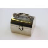 Novelty silver pill box modelled as a casket with handle, gilt interior, Continental hallmarks,