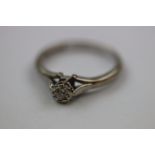 Diamond 18ct white gold solitaire ring, the round old cut diamond weighing approximately 0.10 carat,