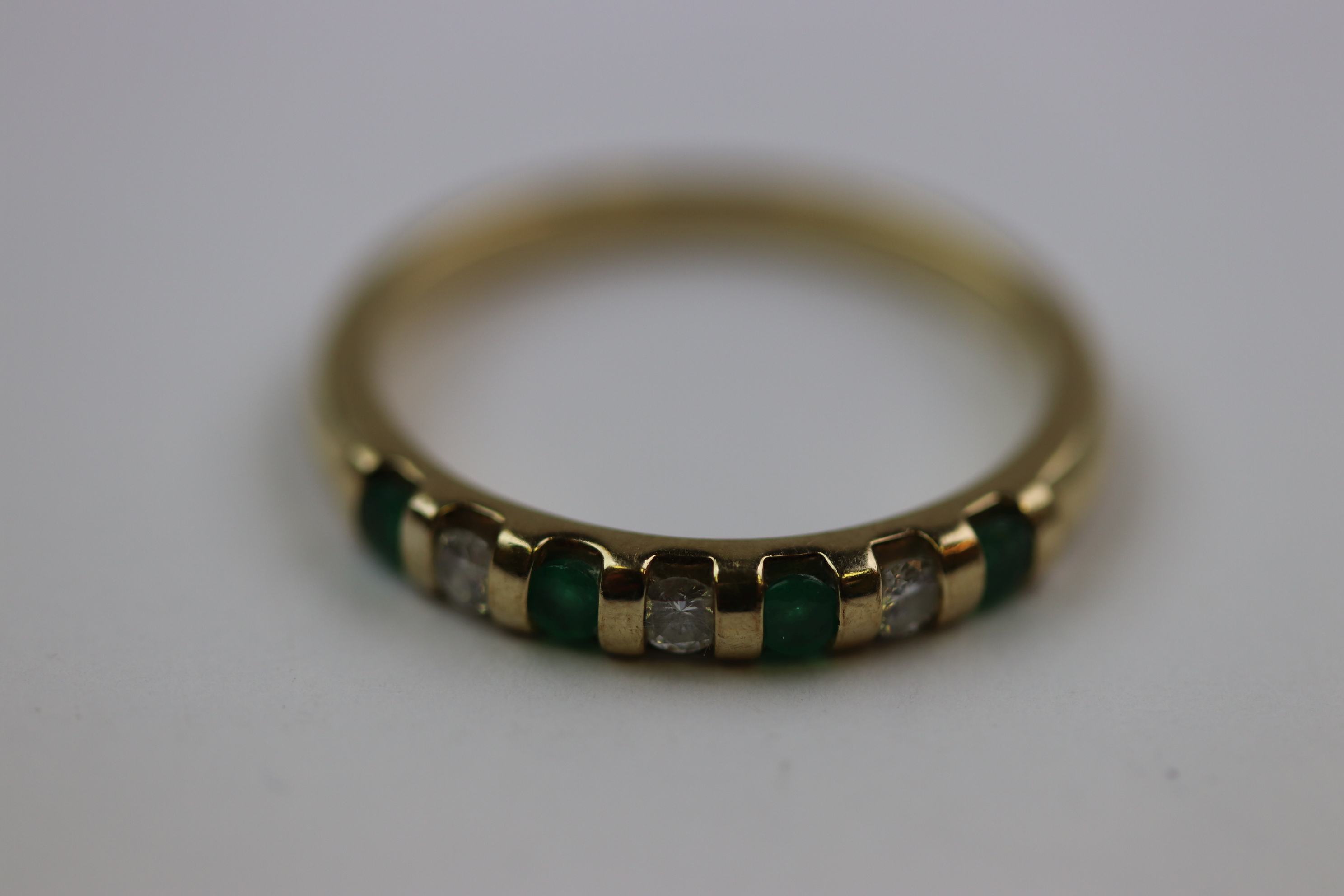 Emerald and diamond seven stone 9ct yellow gold dress ring, four small round mixed cut emerald and - Image 2 of 10