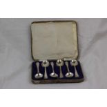 Set of six silver coffee spoons, the terminals with cast golf club and ball motif, makers Walker &