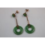 Early 20th century jade rose metal drop earrings, the jade disc suspended from circular jade