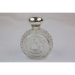 Edwardian large silver topped dressing table cut glass scent bottle, star cut body with graduated