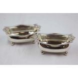 Pair of George III large open silver boat shaped salts raised on four bun feet, gadroon decoration