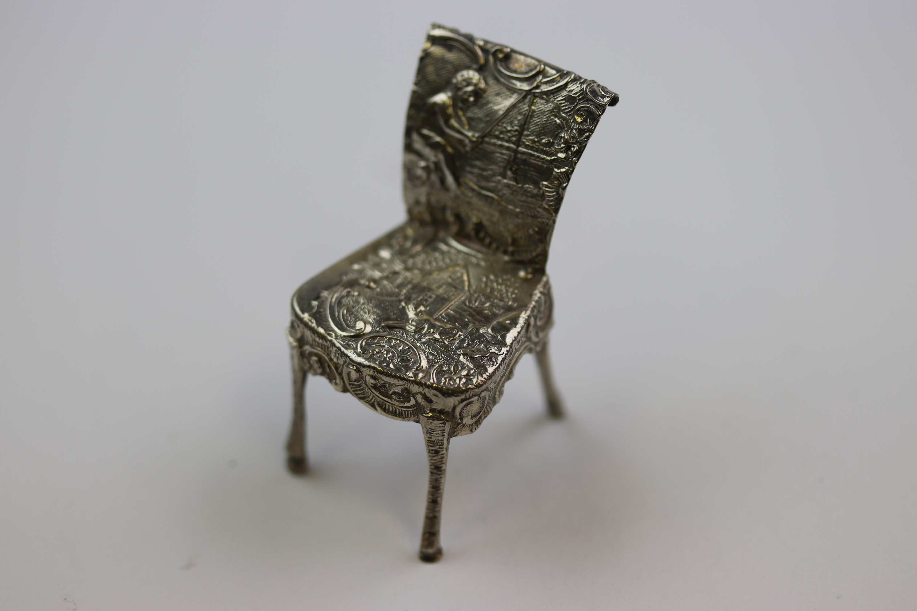 Dutch silver novelty miniature chair with repousse idyllic cottage and dog scene to seat and boy - Image 2 of 6