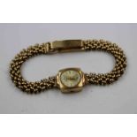 Mid twentieth century ladies Accurist 9ct yellow gold wristwatch, champagne dial with gold baton