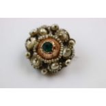Edwardian seed pearl and paste yellow metal brooch, the centre green paste stone with seed pearl