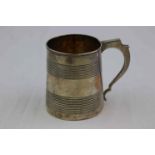 George III silver mug, banded decoration to inverse flared body, chunky scrolled handle, gilt