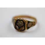 Early Victorian diamond enamelled mourning ring, the central black enamelled panel set with eight