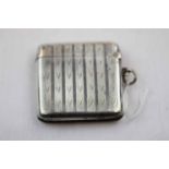 Early George V silver vesta case, ribbed body with repeating wavy design, makers Deakin & Francis