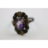 Amethyst silver ring, in the style of Bernard Instone, the central oval mixed cut amethyst measuring