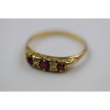 Victorian style ruby and diamond unmarked yellow gold boat head ring, three graduated round mixed