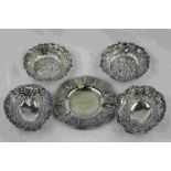 Pair of Victorian silver circular pin dishes, pierced quatrefoil design with repousse floral and