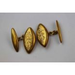 Pair of yellow metal chain link cufflinks, navette shaped panels with engraved foliate scroll
