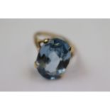 Blue spinel yellow gold dress ring, the oval mixed cut synthetic blue spinel measuring approximately