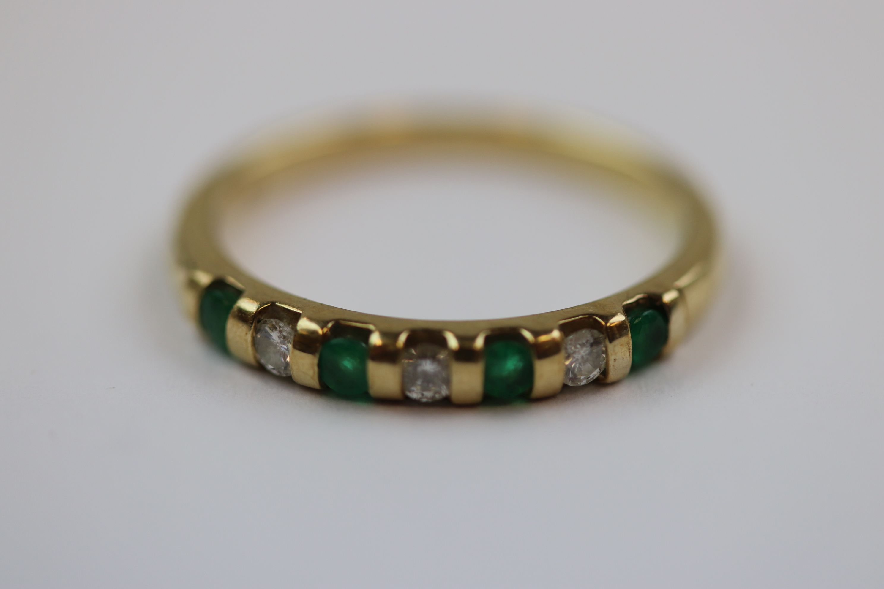 Emerald and diamond seven stone 9ct yellow gold dress ring, four small round mixed cut emerald and - Image 7 of 10