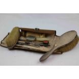 Edwardian silver backed hair brush and clothes brush with fleur-de-lis decoration, makers James