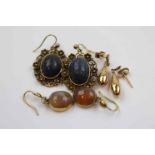 Pair of Victorian pale carnelian yellow metal drop earrings, the oval cabochon cut carnelian